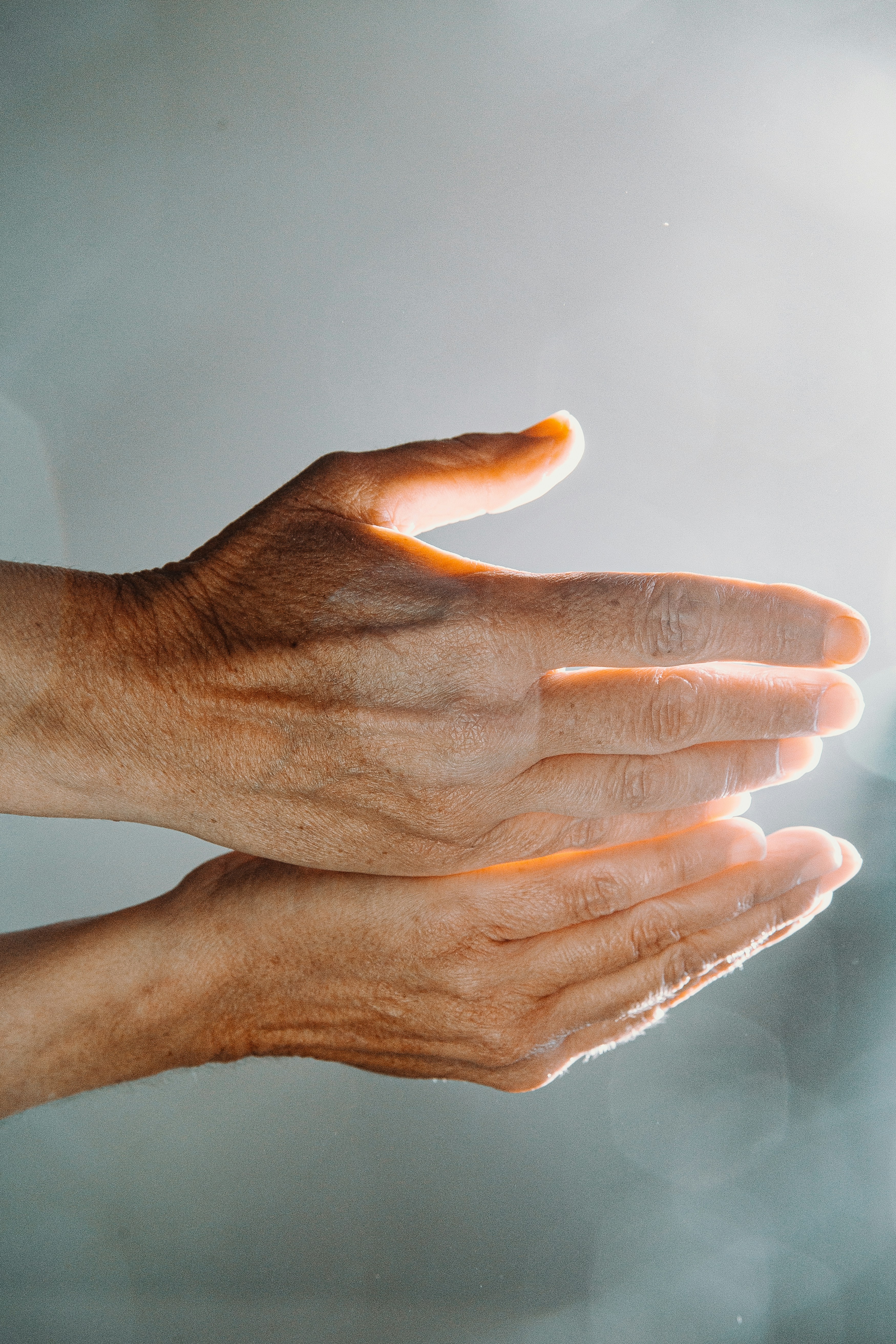 Hands held close together suggesting energy field interaction